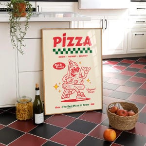 May include: A framed poster with the word "PIZZA" in red, a green and white checkered pattern, and a cartoon pizza slice character. The poster includes the text "Hot & Fresh!" and "Since The Best Pizza In Town - 1981".