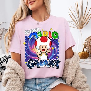 May include: A set of three ceramic mugs with a speckled, matte finish. The mugs are in shades of cream, light brown, and dark brown. Each mug has a simple, minimalist design and a rounded handle.