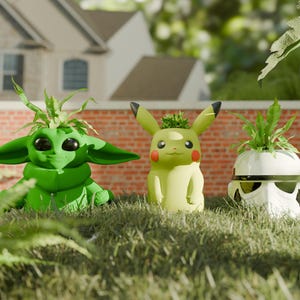 May include: Three character-themed planters sit in grass. A green Baby Yoda planter, a yellow Pikachu planter, and a white Stormtrooper planter, each with a small plant sprouting from the top. The planters are in front of a brick wall and a house.