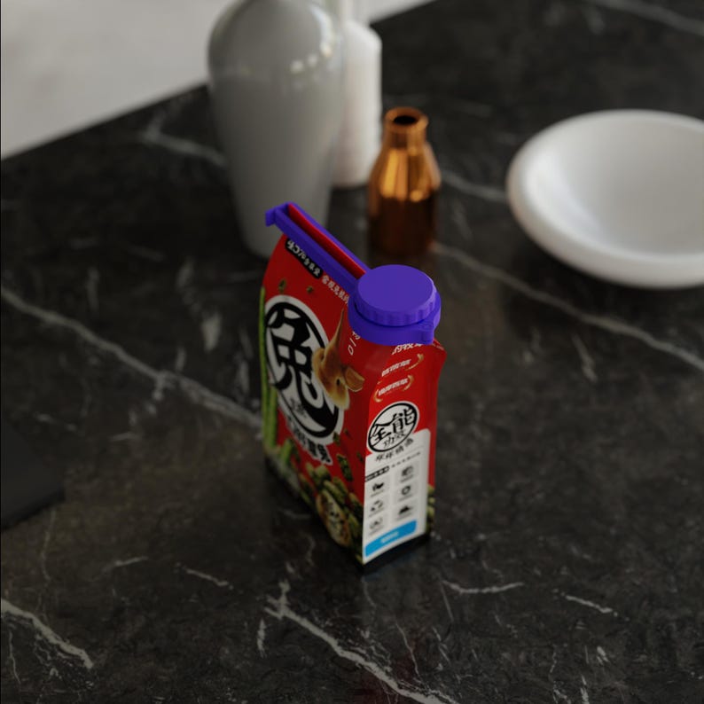 May include: A red and white carton with a purple cap. The carton features Japanese text and graphics. It sits on a dark marble surface, with white vases and a small gold bottle in the background.