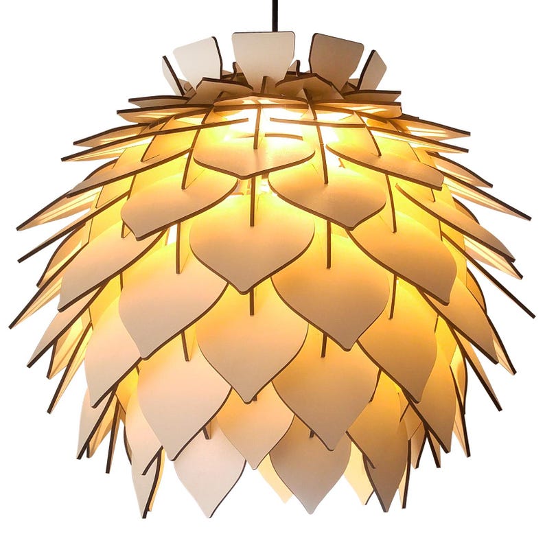 May include: A modern pendant light fixture with a layered design. The light features numerous leaf-shaped wooden panels in shades of cream and brown, creating a warm, inviting glow. The fixture is suspended from a black cord.