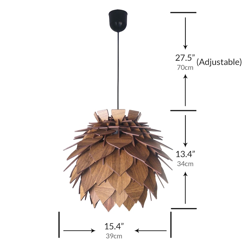 May include: A wooden pendant light fixture with a leaf-like design. The light is 15.4 inches (39cm) wide and 13.4 inches (34cm) tall, with an adjustable height up to 27.5 inches (70cm). The fixture has a black ceiling mount.