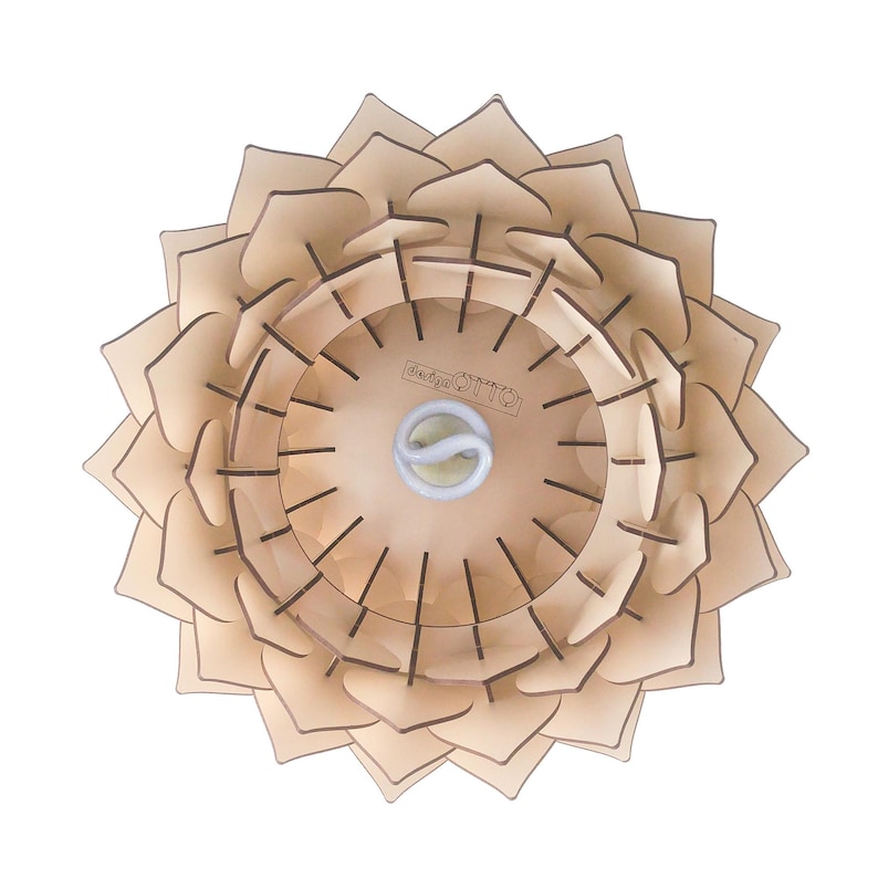 May include: A wooden, layered, flower-shaped light fixture. The fixture has multiple layers of petal-like shapes, with a central light bulb. The design includes the text "Design Otto". The fixture is made of light-colored wood.