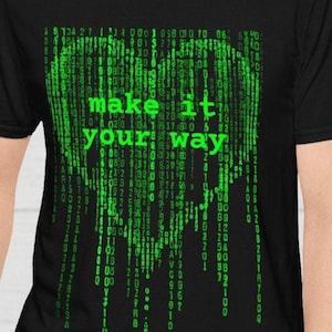 May include: Black t-shirt with a green digital rain design and the words "make it your way". The design resembles code from a computer program. A casual tee for tech enthusiasts.