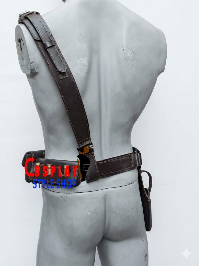 May include: A dark brown leather harness and belt set featuring a shoulder strap, a waist belt with three metallic bullet-shaped cartridges, and a holster attachment. The text COSPLAY STYLE SHOP is printed in red and blue across the belt area.