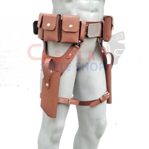 Puede incluir: Cintur&oacute;n utilitario de cuero marr&oacute;n con m&uacute;ltiples bolsillos y una funda. El cintur&oacute;n presenta una hebilla de color plateado y est&aacute; dise&ntilde;ado para usarse alrededor de la cintura y el muslo superior. El cintur&oacute;n est&aacute; dise&ntilde;ado para transportar objetos.