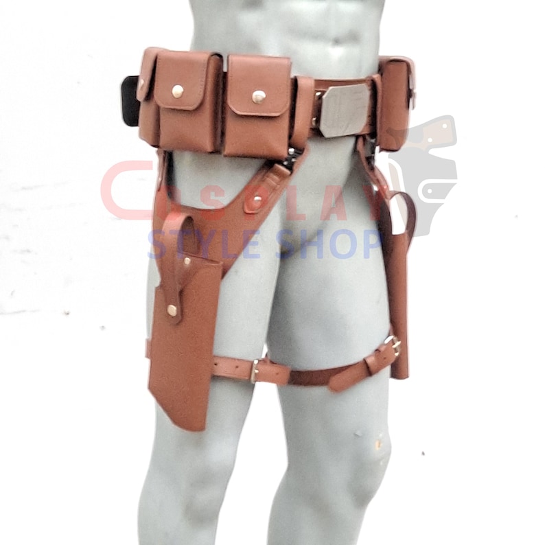 Puede incluir: Cintur&oacute;n utilitario de cuero marr&oacute;n con m&uacute;ltiples bolsillos y una funda. El cintur&oacute;n presenta una hebilla de color plateado y est&aacute; dise&ntilde;ado para usarse alrededor de la cintura y el muslo superior. El cintur&oacute;n est&aacute; dise&ntilde;ado para transportar objetos.