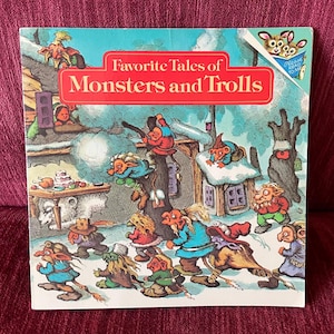 May include: A vintage children's book titled "Favorite Tales of Monsters and Trolls." The cover features a colorful illustration of various troll-like creatures in a snowy landscape. The book has a red banner with white text.