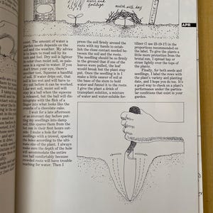 May include: A page from a gardening book featuring black and white line drawings. The top illustration shows a fertilizer can, a watering can, mulch, and a plant marker labeled "LETTUCE 4/14". The bottom illustration shows a hand using a trowel.