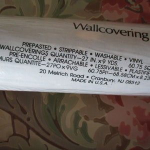 May include: A roll of pre-pasted, strippable, washable vinyl wallcovering. The label indicates a quantity of 68.58cm x 8.23m. The floral design features pink and green hues. Made in the U.S.A.