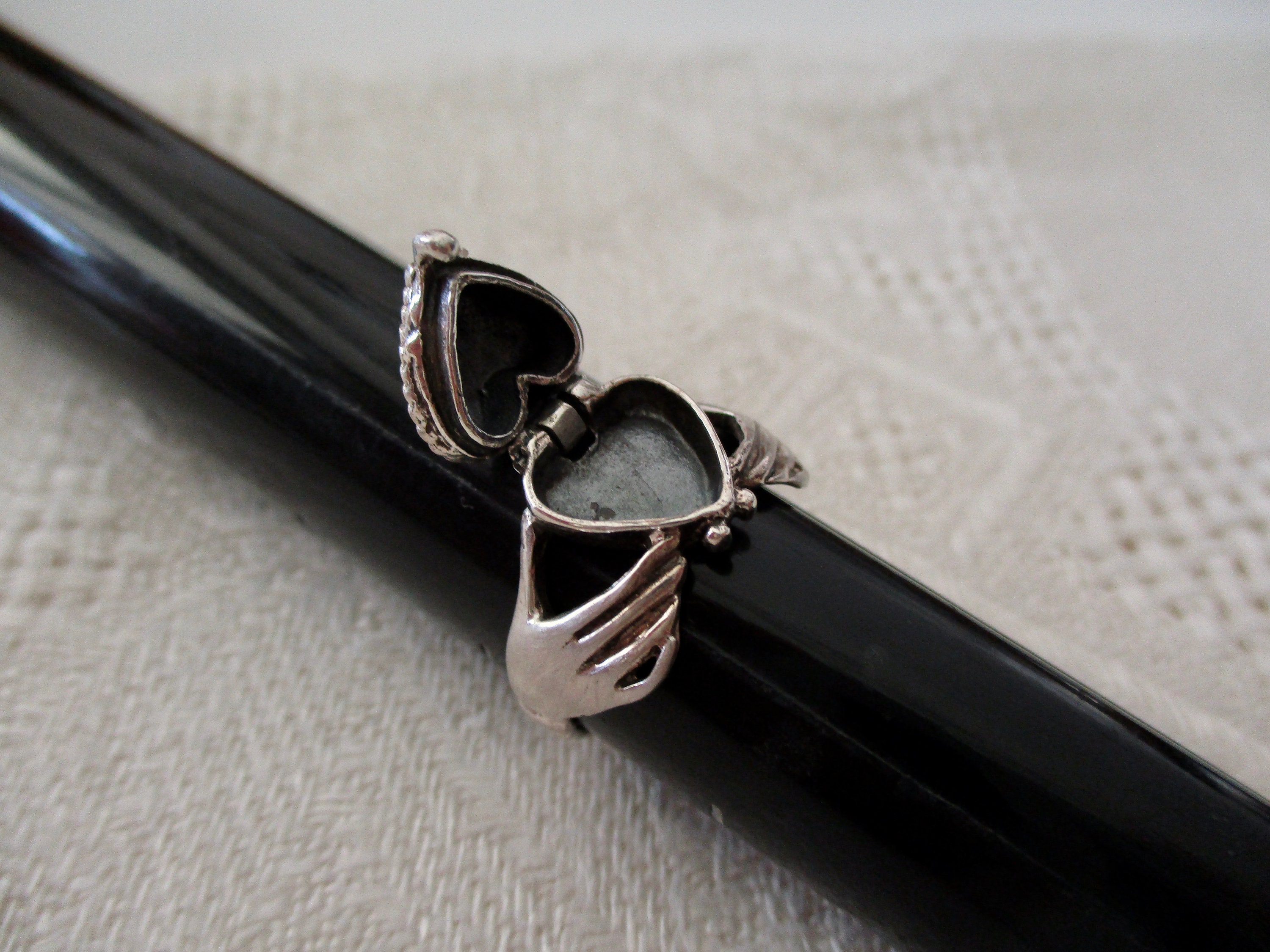 sterling poison heart ring - claddagh, secret compartment, heart in hands, heart opens, size 7