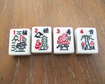 May include: Four white Mahjong tiles with black, red, and green illustrations and Chinese characters. The tiles are numbered 1 through 4. The illustrations include a boat, mountains, a pagoda, and a tree.