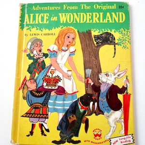 May include: A vintage book cover for "Alice in Wonderland" by Lewis Carroll. The cover is yellow with illustrations of Alice, the White Rabbit, the Mad Hatter, and other characters. The title is in green, and the book is labeled "Wonder Books."