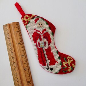 tiny needlepoint Christmas STOCKING ornament with Santa holding gift, vintage, miniature