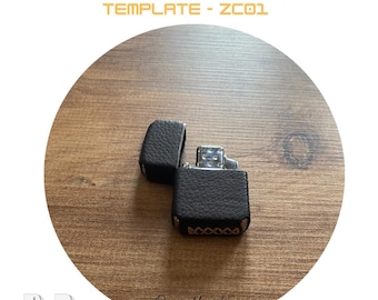May include: A black leather case for a Zippo lighter. The case has a stitched design around the edges. The case is open and the lighter is visible inside. The lighter is silver with a black flint wheel. The image is on a wooden background. The text "ZIPPO CASE TEMPLATE - ZC01" is at the top of the image. The text "Designed by US" is at the bottom of the image.