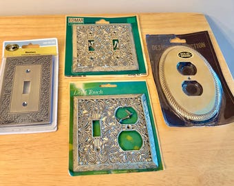 Plaques murales vintage en laiton. Lot de 4- Edmar, Designer Perfection, Light Touch et Hampton Bay. Couvercles d'interrupteur et de prise de courant neufs.