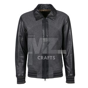 May include: A grey wool jacket with black leather sleeves and collar. The jacket features a full-length zip, ribbed cuffs, and a ribbed hem. A classic style, suitable for various occasions.