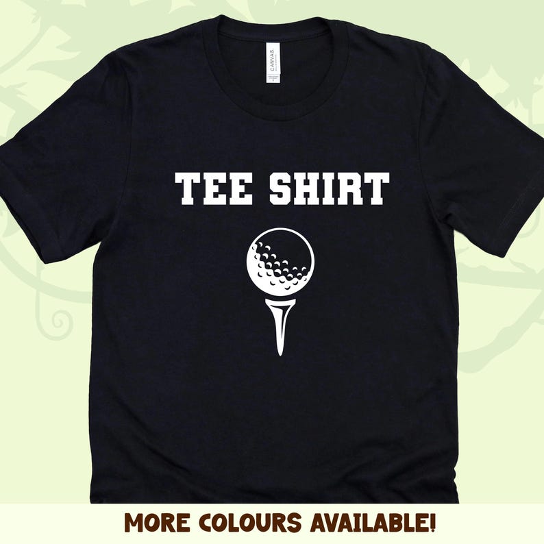 May include: Black tee shirt with white text that says "TEE SHIRT" and a white golf ball on a tee.