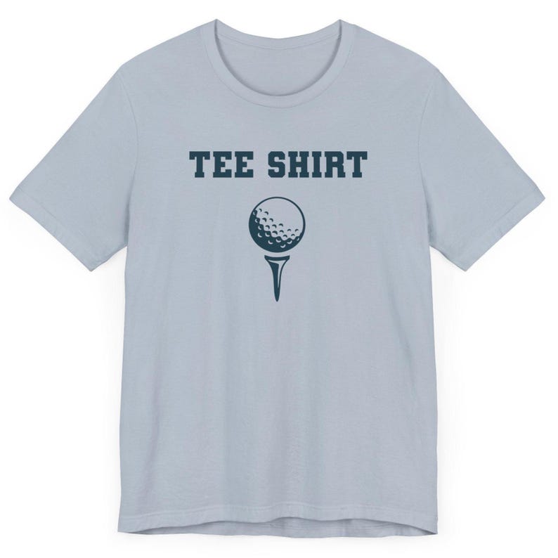May include: A light blue t-shirt with the text "TEE SHIRT" in dark blue letters and a golf ball on a tee printed in dark blue.