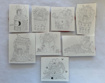 May include: A collection of eight black and white line drawings on paper. Each drawing depicts a fairy or similar whimsical character interacting with flowers, a birdhouse, a watering can, a well, a book, and a beehive. The drawings are detailed and delicate.