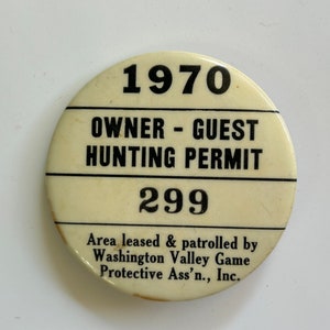 May include: Cream-colored, circular hunting permit from 1970. The permit features black text that reads "OWNER - GUEST HUNTING PERMIT" and "299". The bottom of the permit states "Area leased & patrolled by Washington Valley Game Protective Ass'n., Inc."