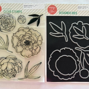 May include: Clear stamps and designer dies for crafting. The clear stamps feature detailed line drawings of peony flowers and leaves. The designer dies are metal cutouts of the same floral elements. The products are labeled "Mondo Peony" by Ellen.