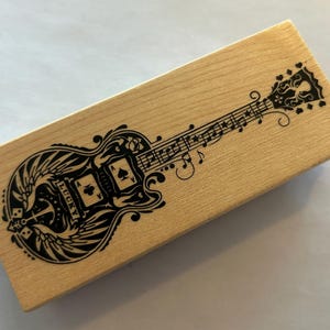 rubber stamp - Mindscape GUITAR stamp, lucky Aces winged guitar octopus - Inkadinkado 60-01056 - D11