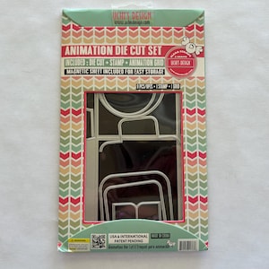 May include: An animation die cut set in a colorful package. The package includes a die cut, stamp, and animation grid. The package has the text "Animation Die Cut Set" and "Magnetic Sheet Included For Easy Storage".
