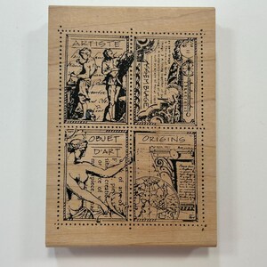 May include: A rectangular wooden rubber stamp featuring four distinct black ink illustrations arranged in a grid. The designs include figures labeled ARTISTE, ASSEMBLAGE, OBJET D'ART, and ORIGINS, each surrounded by a dotted border frame.