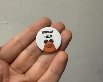 Marcus the worm: Robert Help pin back button badge.