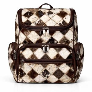 May include: A two-piece travel set featuring a backpack and a smaller bag. The bags are made of a patchwork design with brown and white diamond-shaped patterns. The bags have brown leather trim and silver zippers.