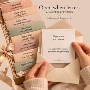 May include: A gift set of "Open When" letters in a decorative box. The set includes several small envelopes with prompts like "Open when you miss me" and "Open when you feel down." The box is tied with a ribbon.