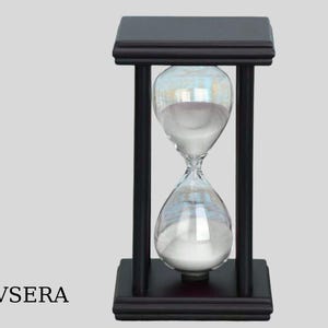 May include: A black wooden hourglass with a square top and base, supporting a clear glass hourglass filled with white sand. The hourglass is a classic timekeeping device, perfect for home decor or as a gift.