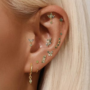 Pendientes de siesta, pendientes de ágata musgosa, pendientes de torre, pendientes trepadores, pendientes de espalda plana, pendientes de hélice, pendientes de caracola, pendientes de aro dorados.