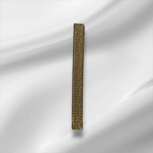 May include: A long, narrow, rectangular patch featuring a metallic gold embroidered surface with a dense, textured thread pattern. The edges are finished with a clean, straight border, creating a structured and uniform appearance for this applique.