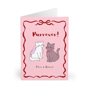 May include: A pink greeting card with a red decorative border and bow. The card features two cartoon cats, one white with a pink veil and the other gray with a pink bow tie. The text "Purrever!" is above the cats, with "Olivia & Richard" below.