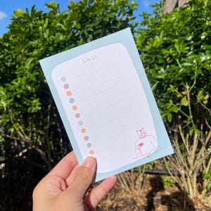 Cute Cat To Do List A6 Notepad for Daily Tasks Cat Holding Coffee Tear Off Planner Pad Perfect Gift for Cat Lovers and Stationery Fans