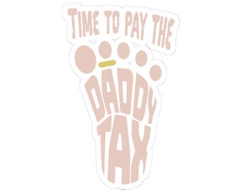 May include: A pink and gold sticker with the text "Time to pay the Daddy Tax" and a footprint design.