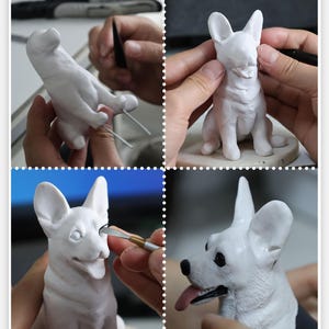 May include: A white ceramic dog sculpture is being sculpted by hand. The artist is using tools to shape the dog's face, ears, and body. The sculpture is in various stages of completion, showing the process of creating a realistic dog sculpture.