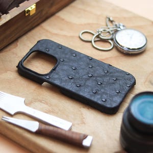 May include: A rustic wooden sign with the text "Welcome to our home" in white lettering. The sign has a distressed finish and a simple, inviting design, suitable for a front porch or entryway.