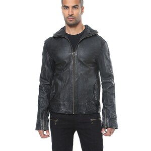 May include: A black leather jacket with a zipper closure and a stand-up collar. The jacket has two zippered pockets on the front and two zippered pockets on the sleeves.
