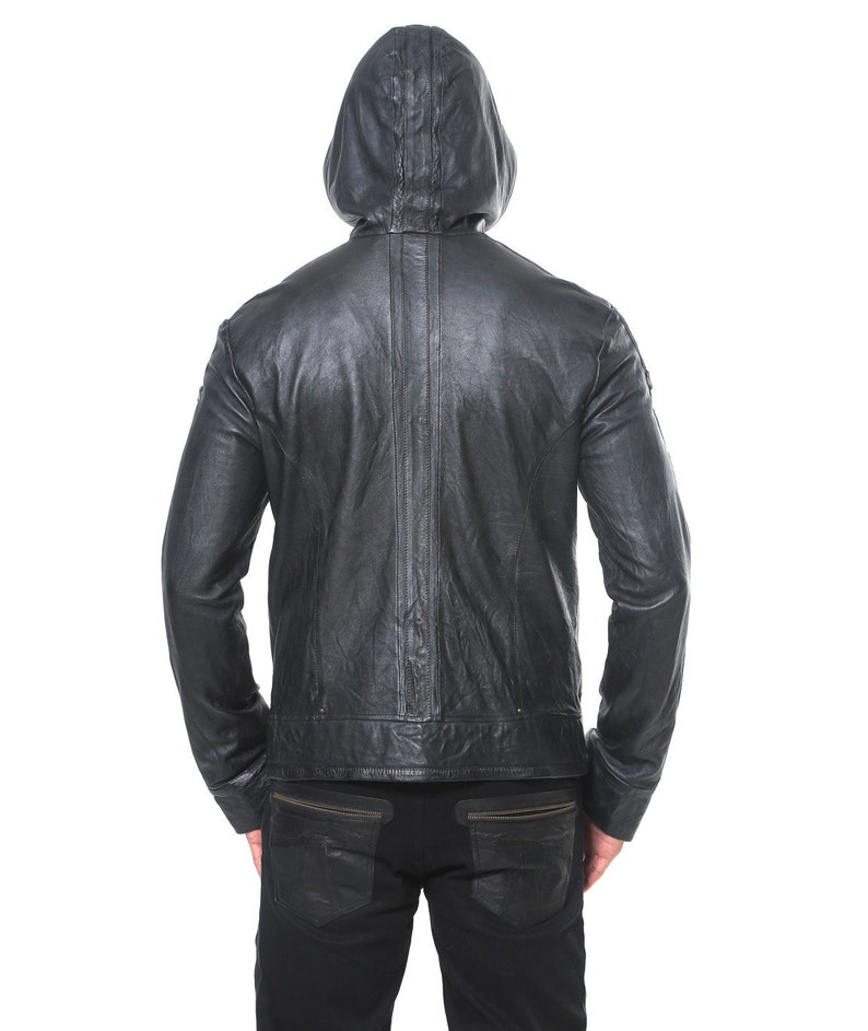 May include: Black leather jacket with a hood. The jacket has a zipper closure and a seam down the back.