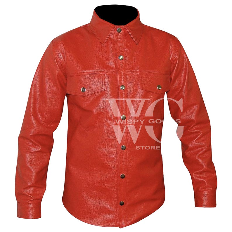 Front view of a long-sleeved, collared men's shirt made from textured vibrant red leather. The shirt features a central vertical button placket with silver snap fasteners, two symmetrical chest pockets with pointed flaps secured by silver snaps, and a curved hemline. The material has a distinct, fine pebble-grained leather texture.