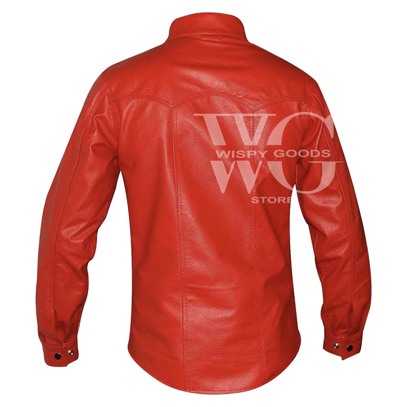Back view of the long-sleeved red leather shirt. It highlights a curved western-style yoke across the upper shoulders with double-stitched vertical seams running down to the slightly curved hem. The cuffs on the long sleeves are finished with a single visible snap button closure.