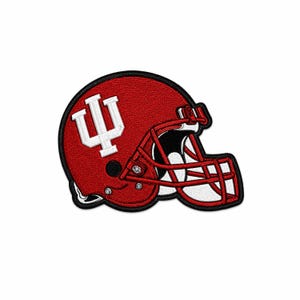 May include: An embroidered patch shaped like a football helmet in red with a white interlocking IU logo on the side. The helmet features a red face mask, a black interior opening, and a thick black border outlining the entire design.
