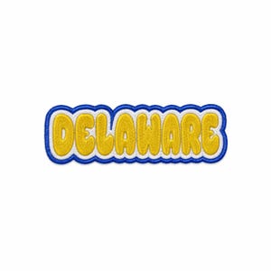 May include: An embroidered patch featuring the word DELAWARE in yellow, rounded, bubble-style lettering. The text is outlined in a thick white border, which is then framed by a scalloped, royal blue embroidered edge on a white background.