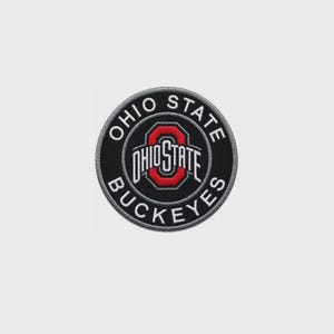 May include: A circular embroidered patch featuring a black background with a grey border. The text OHIO STATE BUCKEYES is stitched in white around the center, which displays a red block O logo with the white text OHIO STATE inside the letter.