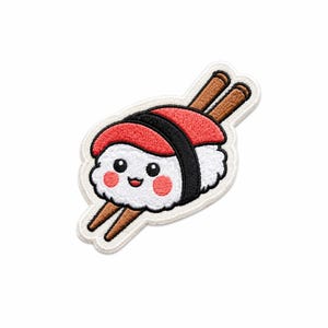 May include: An embroidered patch featuring a piece of nigiri sushi with a white rice base, a red fish topping, and a black seaweed strip. The sushi has a smiling face with pink cheeks and is positioned between two brown wooden chopsticks.