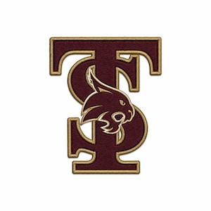 May include: An embroidered patch featuring the letters T and S in a deep maroon color with a gold border. A stylized bobcat head in maroon with gold outlines is positioned in the center, overlapping the letters to create a cohesive emblem design.
