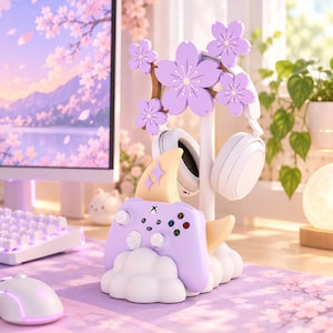 May include: A white gaming accessory stand featuring a light purple controller holder shaped like a cloud, topped with a crescent moon accent, and a vertical post decorated with light purple cherry blossom flowers to hold white headphones.